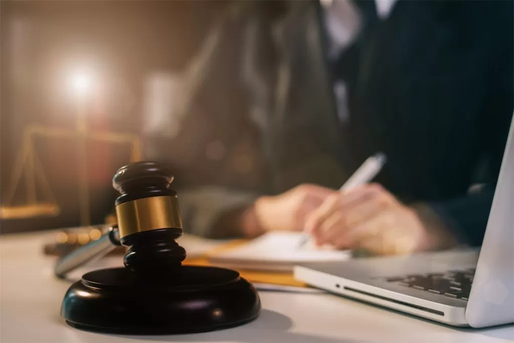 Attorney reviewing legal documents related to a lemon law court case